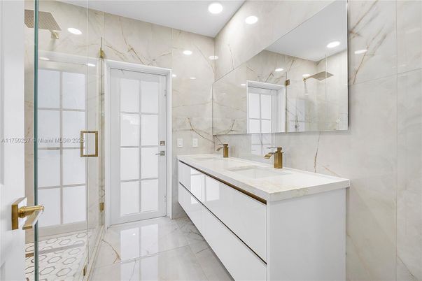Bathroom, Dual Sink Vanities, Glass Shower, Interior, Marble, Marble Walls, Recessed Lighting