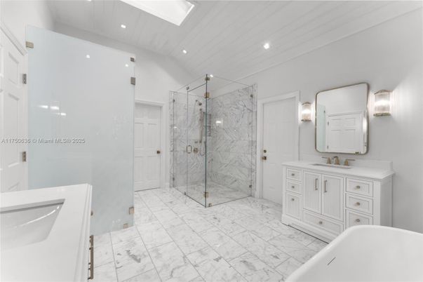 Bathroom, Dual Sink Vanities, Free Standing Baths, Glass Shower, Interior, Marble, Marble Walls, Recessed Lighting