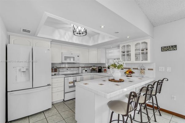 Interior, Kitchen, Recessed Lighting, Stainless Steel Appliances, Tile Countertops