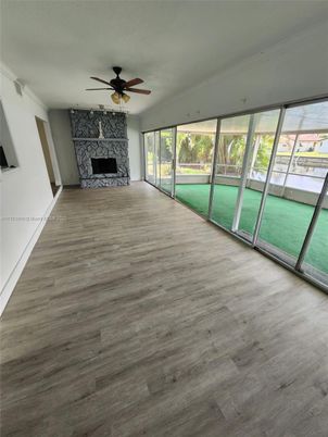 Empty room, Fireplace, Interior, Sun Room, Wood Texture Flooring
