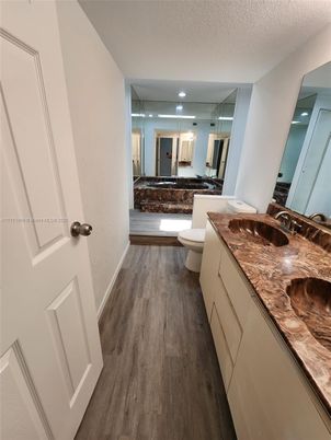 Bathroom, Dual Sink Vanities, Interior, Recessed Lighting, Wood Texture Flooring