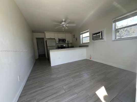 Empty room, Interior, Kitchen, Stainless Steel Appliances, Wood Texture Flooring
