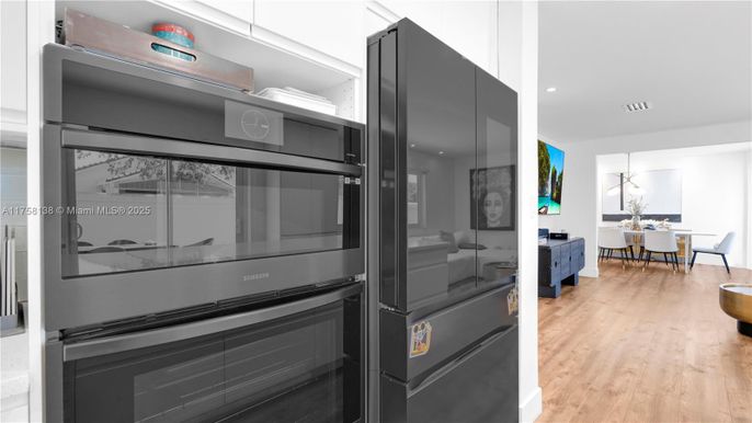 Dining room, Interior, Kitchen, Pendant Lights, Recessed Lighting, Stainless Steel Appliances, Wood Texture Flooring