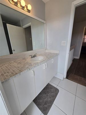 Bathroom, Dual Sink Vanities, Interior, Tile Countertops, Wood Texture Flooring
