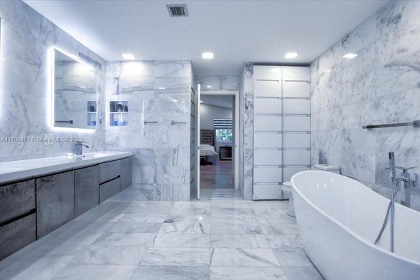 Bathroom, Dual Sink Vanities, Free Standing Baths, Interior, Marble, Marble Walls, Recessed Lighting