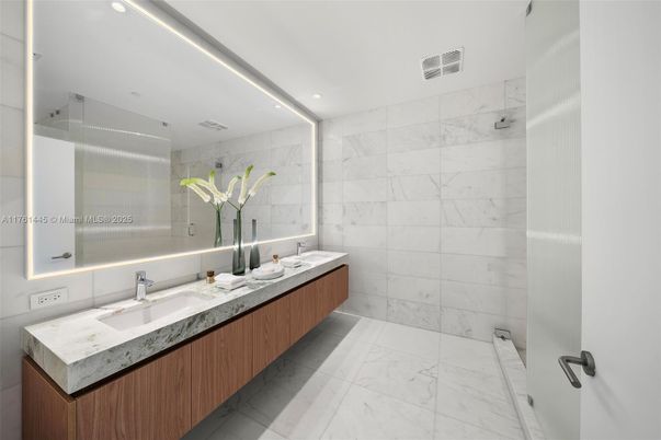 Bathroom, Dual Sink Vanities, Glass Shower, Interior, Marble, Marble Walls, Recessed Lighting