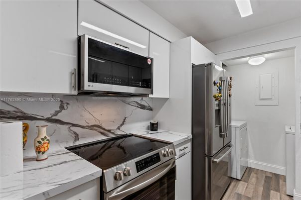 Interior, Kitchen, Marble Walls, Stainless Steel Appliances, Wood Texture Flooring
