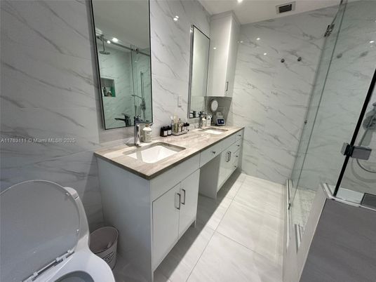Bathroom, Dual Sink Vanities, Glass Shower, Interior, Marble Walls, Recessed Lighting