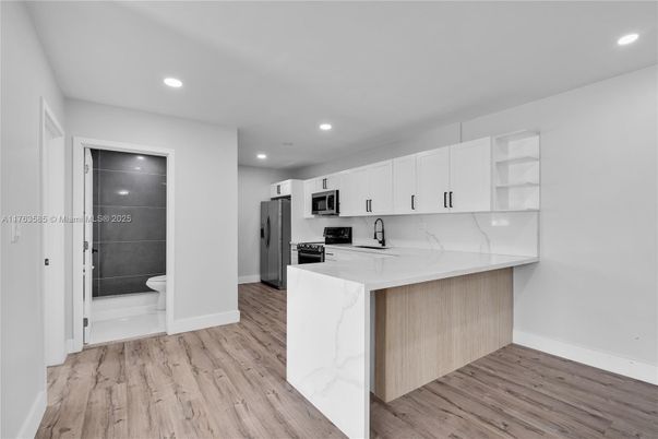 Interior, Kitchen, Recessed Lighting, Stainless Steel Appliances, Wood Texture Flooring