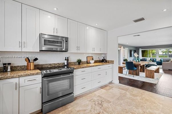 Dining room, Interior, Kitchen, Living room, Recessed Lighting, Stainless Steel Appliances, Wood Texture Flooring