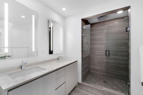 Bathroom, Dual Sink Vanities, Glass Shower, Interior, Recessed Lighting, Wood Texture Flooring