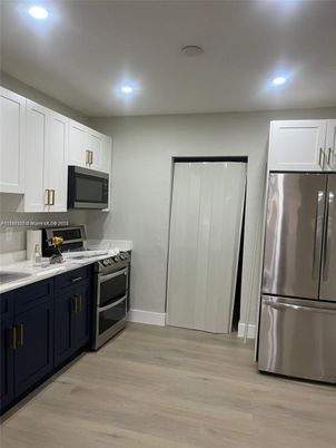 Interior, Kitchen, Recessed Lighting, Stainless Steel Appliances, Wood Texture Flooring