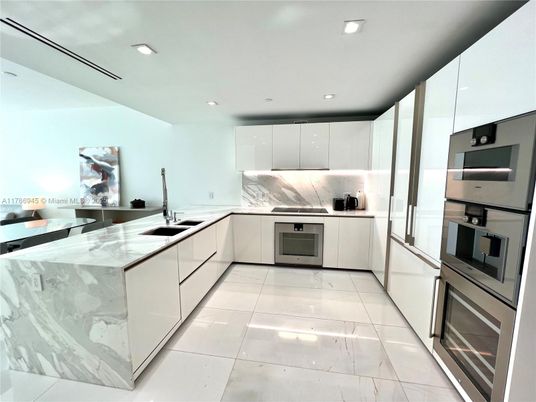 Interior, Kitchen, Marble Walls, Recessed Lighting, Stainless Steel Appliances