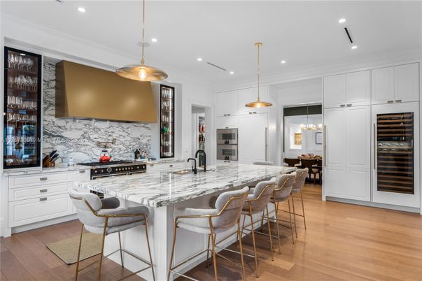 Interior, Kitchen, Marble Walls, Pendant Lights, Recessed Lighting, Stainless Steel Appliances, Wood Texture Flooring