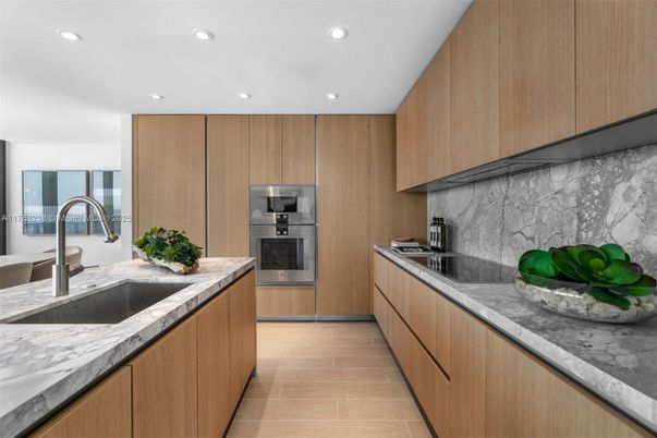 Interior, Kitchen, Marble Walls, Recessed Lighting, Stainless Steel Appliances