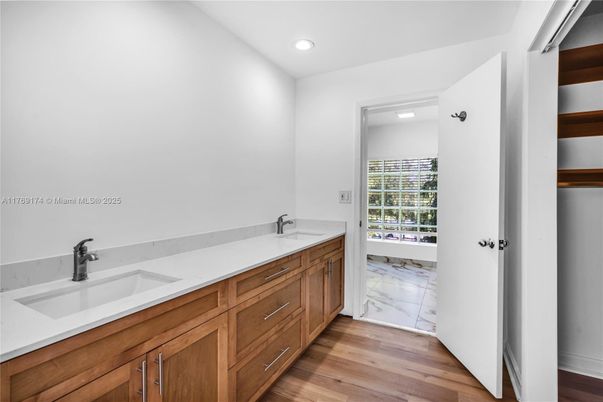 Bathroom, Dual Sink Vanities, Interior, Marble, Recessed Lighting, Wood Texture Flooring