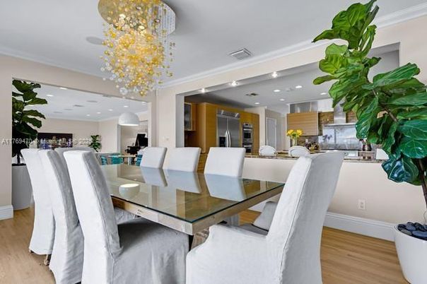 Chandelier, Dining room, Interior, Kitchen, Pendant Lights, Recessed Lighting, Stainless Steel Appliances, Wood Texture Flooring