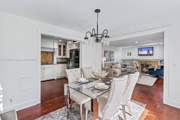 Chandelier, Dining room, Fireplace, Interior, Living room, Pendant Lights, Recessed Lighting, Wood Texture Flooring