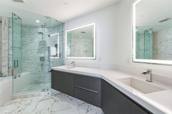 Bathroom, Dual Sink Vanities, Glass Shower, Interior, Marble, Marble Walls, Recessed Lighting