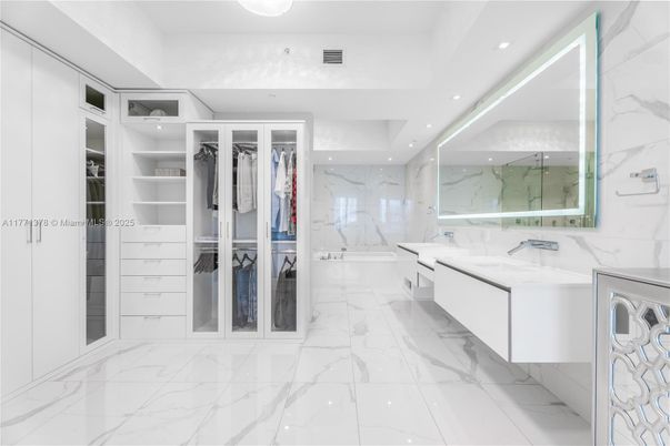 Bathroom, Dual Sink Vanities, Interior, Marble, Marble Walls, Recessed Lighting, Walk-in Closets