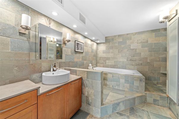 Bathroom, Dual Sink Vanities, Interior, Recessed Lighting, Stone Walls