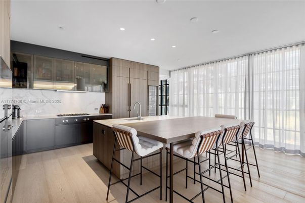 Interior, Kitchen, Marble Walls, Recessed Lighting, Stainless Steel Appliances, Wood Texture Flooring
