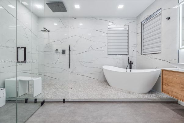 Bathroom, Free Standing Baths, Glass Shower, Interior, Marble Walls, Recessed Lighting