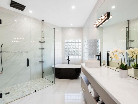 Bathroom, Dual Sink Vanities, Free Standing Baths, Glass Shower, Interior, Marble, Marble Walls, Recessed Lighting