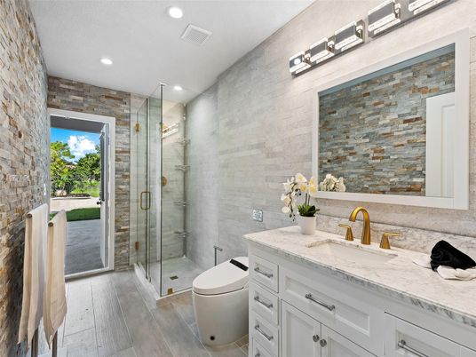Bathroom, Dual Sink Vanities, Glass Shower, Interior, Recessed Lighting, Stone Walls, Wood Texture Flooring