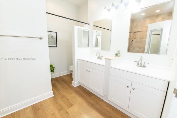 Bathroom, Dual Sink Vanities, Interior, Recessed Lighting, Wood Texture Flooring