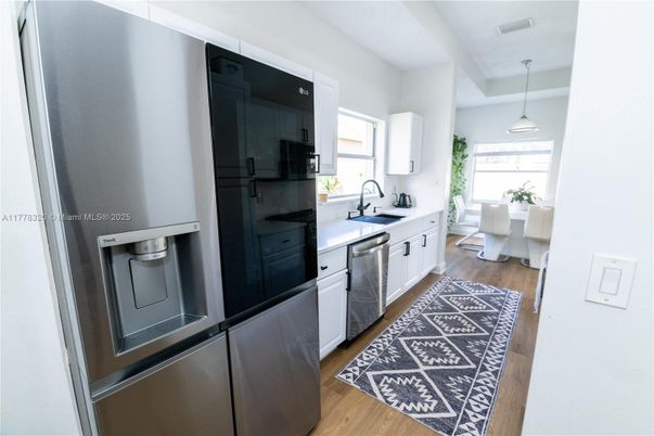Dining room, Interior, Kitchen, Pendant Lights, Stainless Steel Appliances, Wood Texture Flooring