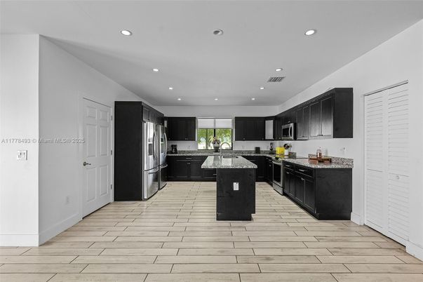 Interior, Kitchen, Recessed Lighting, Stainless Steel Appliances, Wood Texture Flooring