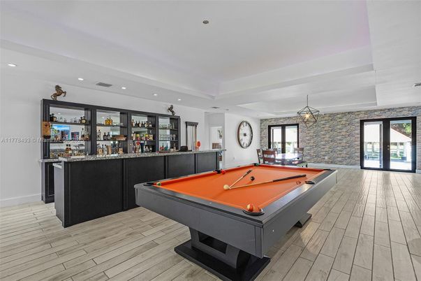Billiard Table, Game Room, Interior, Pendant Lights, Recessed Lighting, Stone Walls, Wood Texture Flooring