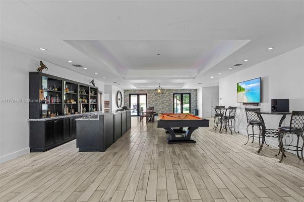 Billiard Table, Dining room, Game Room, Interior, Recessed Lighting, Stone Walls, Wood Texture Flooring