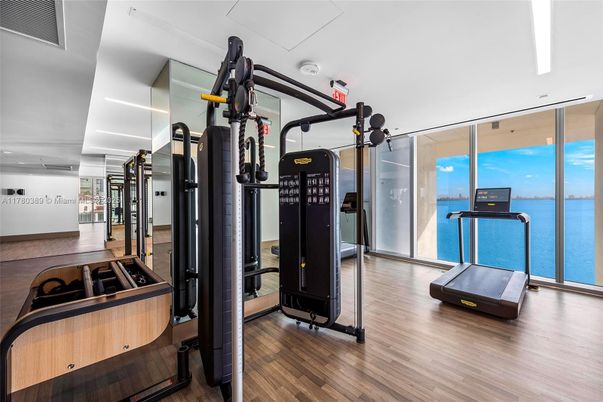 Fitness Equipment, Gym, Interior, Recessed Lighting, Water, Wood Texture Flooring