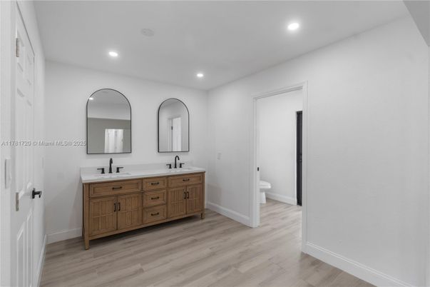 Bathroom, Dual Sink Vanities, Interior, Recessed Lighting, Wood Texture Flooring