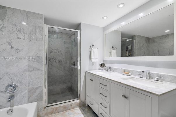 Bathroom, Dual Sink Vanities, Glass Shower, Interior, Marble Walls, Recessed Lighting