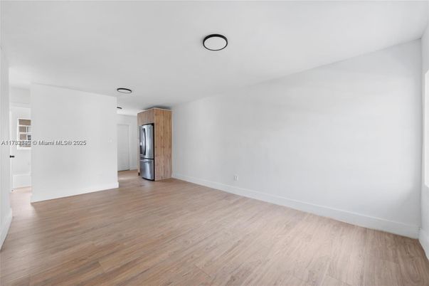 Empty room, Interior, Kitchen, Stainless Steel Appliances, Wood Texture Flooring
