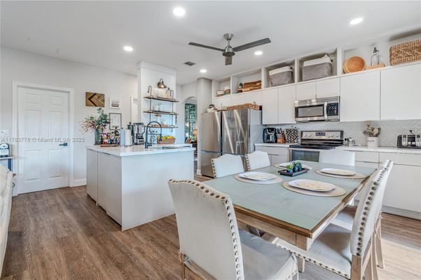 Dining room, Interior, Kitchen, Recessed Lighting, Stainless Steel Appliances, Wood Texture Flooring