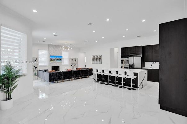 Fireplace, Interior, Kitchen, Living room, Marble, Pendant Lights, Recessed Lighting, Stainless Steel Appliances