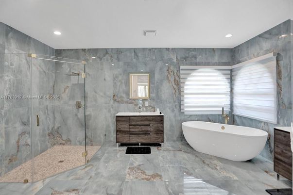 Bathroom, Dual Sink Vanities, Free Standing Baths, Glass Shower, Interior, Marble, Marble Walls, Recessed Lighting