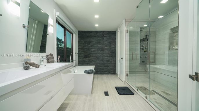 Bathroom, Dual Sink Vanities, Free Standing Baths, Glass Shower, Interior, Recessed Lighting, Wood Texture Flooring
