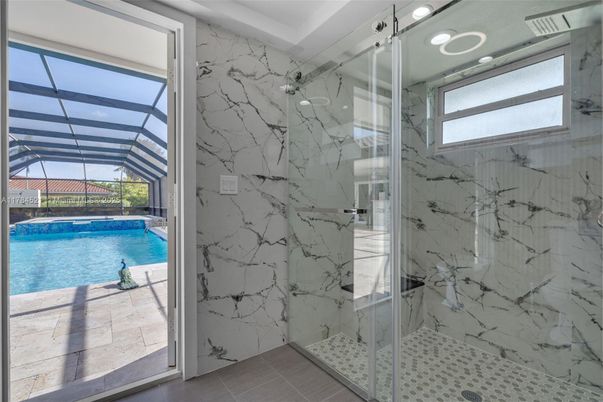 Bathroom, Glass Ceilings, Glass Shower, Interior, Marble Walls, Pool, Recessed Lighting, Sun Room