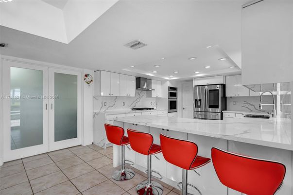 Interior, Kitchen, Marble Walls, Recessed Lighting, Stainless Steel Appliances