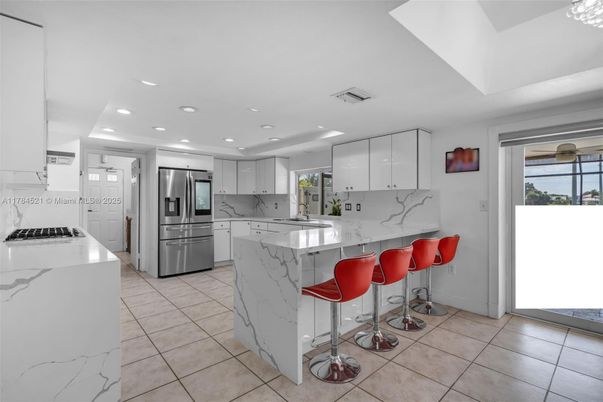 Interior, Kitchen, Marble Walls, Recessed Lighting, Stainless Steel Appliances