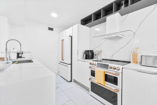 Interior, Kitchen, Marble, Marble Walls, Recessed Lighting, Stainless Steel Appliances