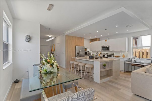 Dining room, Interior, Kitchen, Pendant Lights, Recessed Lighting, Stainless Steel Appliances, Wood Texture Flooring