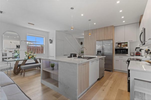 Dining room, Interior, Kitchen, Pendant Lights, Recessed Lighting, Stainless Steel Appliances, Wood Texture Flooring