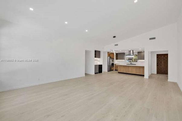 Empty room, Interior, Kitchen, Pendant Lights, Recessed Lighting, Stainless Steel Appliances, Wood Texture Flooring