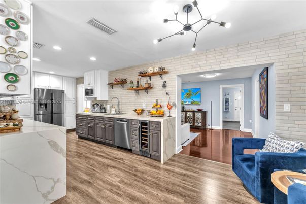 Interior, Kitchen, Living room, Pendant Lights, Recessed Lighting, Stainless Steel Appliances, Stone Walls, Wood Texture Flooring